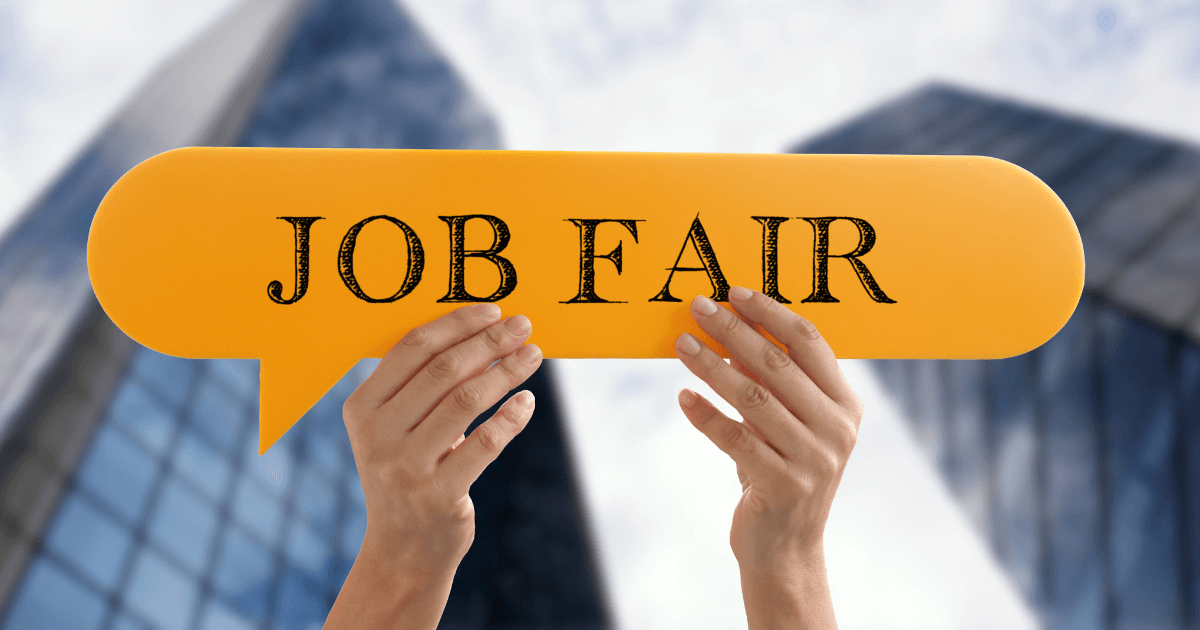 A pair of hands holding up a paper talk bubble into the air. The text inside the bubble reads "Job Fair".