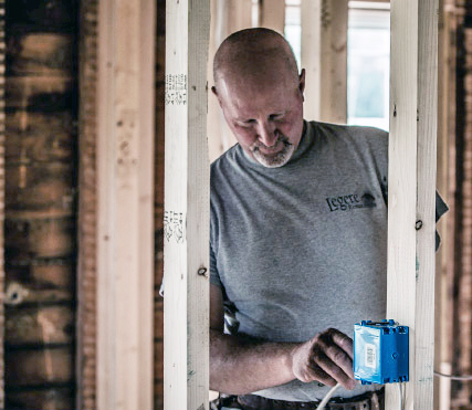 Photo of Marty installing electrical wiring
